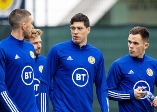 Scotland's Declan Gallagher, Scott McKenna and Lawrence Shankland during a training session