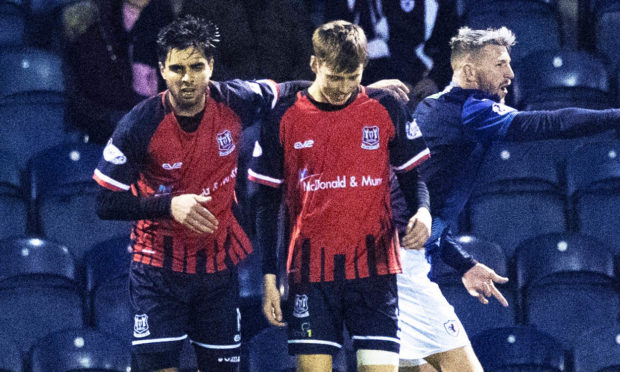 Kane Hester, right, celebrates his goal.