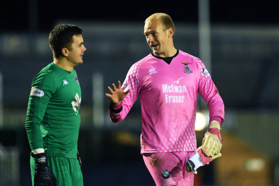 Inverness' Mark Ridgers, right, chats with Clyde's David Mitchell at full-time during the Tunnock's Caramel Wafer Challenge Cup quarter-final match.