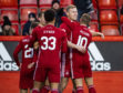 Aberdeen's Sam Cosgrove celebrates with his team-mates after scoring to make it 1-0.