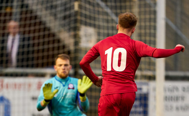 Brora's Andrew MacRae scores his 1st.