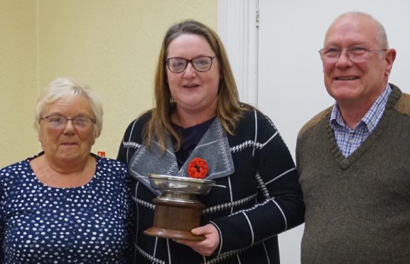 The Macduff Quaich 2019 being presented to Claire Nicholson by Banff and Macduff Community Council chairwoman Kathleen Mustard and community councillor Richard Menard