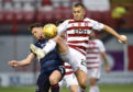 Scott Martin (right) competes with Ross County's Lewis Spence during the Ladbrokes Premiership match at New Douglas Park