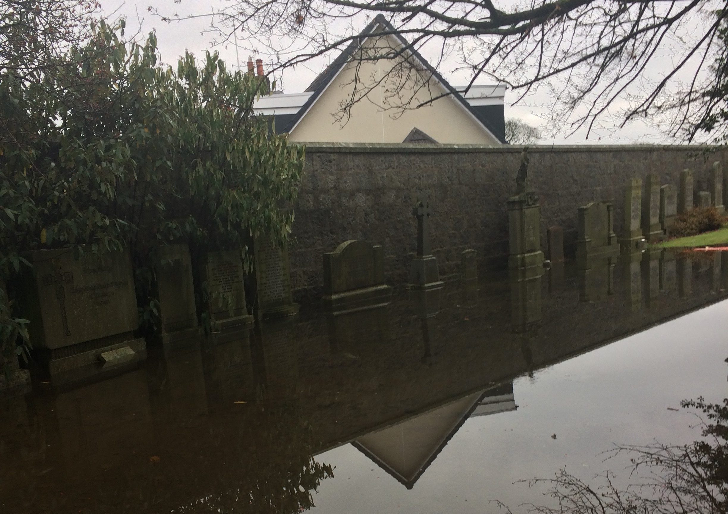 Springbank Cemetery graves flooded. Pic by Neil Drysdale.