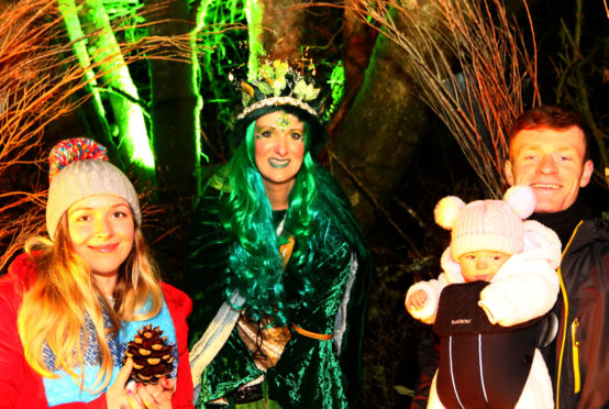 Sarah Jane Hughes and Mark Lockhart take their daughter Ferne to Fairy Queen Dorothy Simpson at the Oban Winter Festival