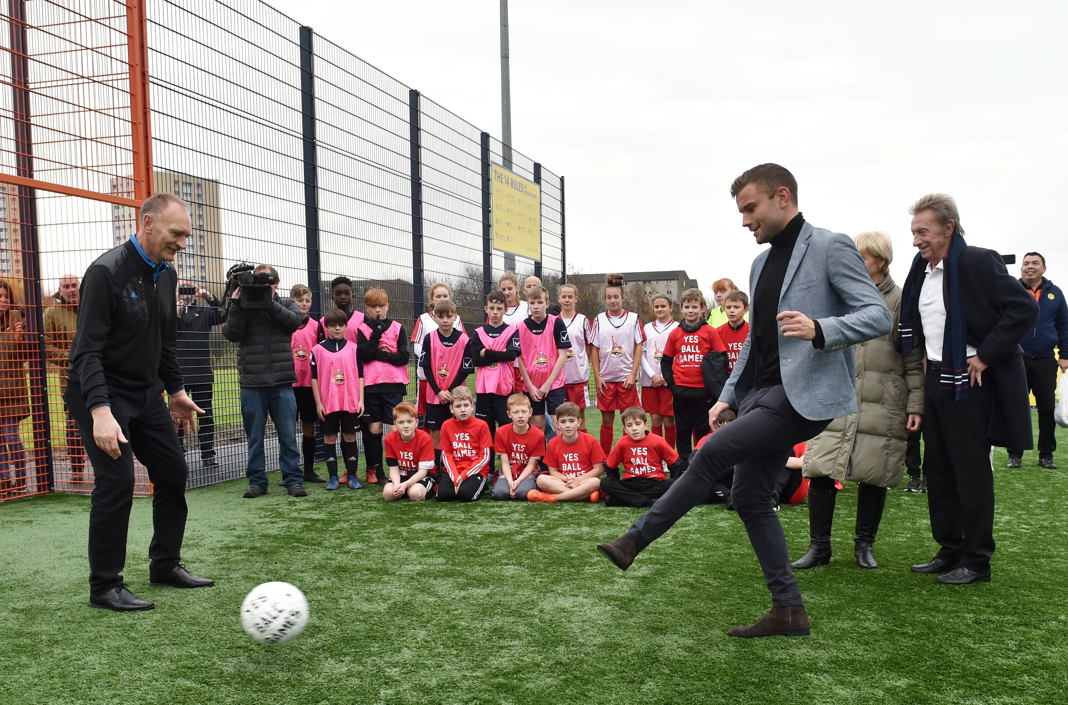 Cruyff Court - Neal Cooper was officially opened adjacent to Tullos Primary School. Alex Cooper strikes the ball towards goal keeper Jim Leighton.
Picture by COLIN RENNIE