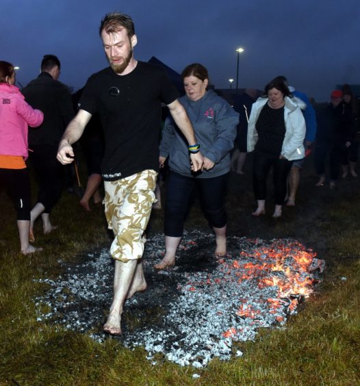 Fire walk at Barclay park in aid of Shape Up Peterhead. 
Picture by Jim Irvine