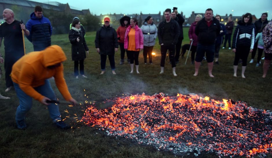 Dougie Bogie setting up the fire walk. 
Picture by Jim Irvine
