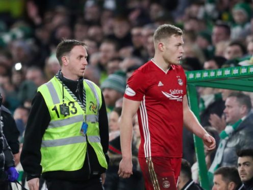 Sam Cosgrove of Aberdeen walks towards the tunnel after being sent off by Referee Euan Anderson