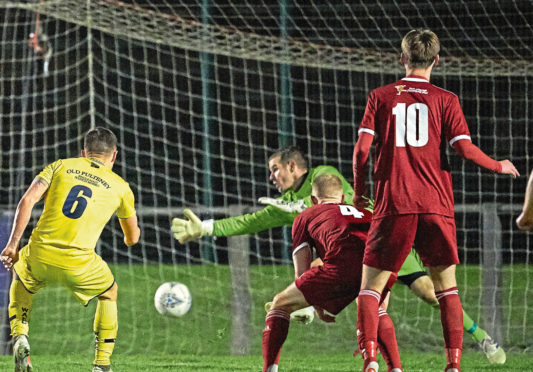 Wick's Jack Henry scores the equaliser.