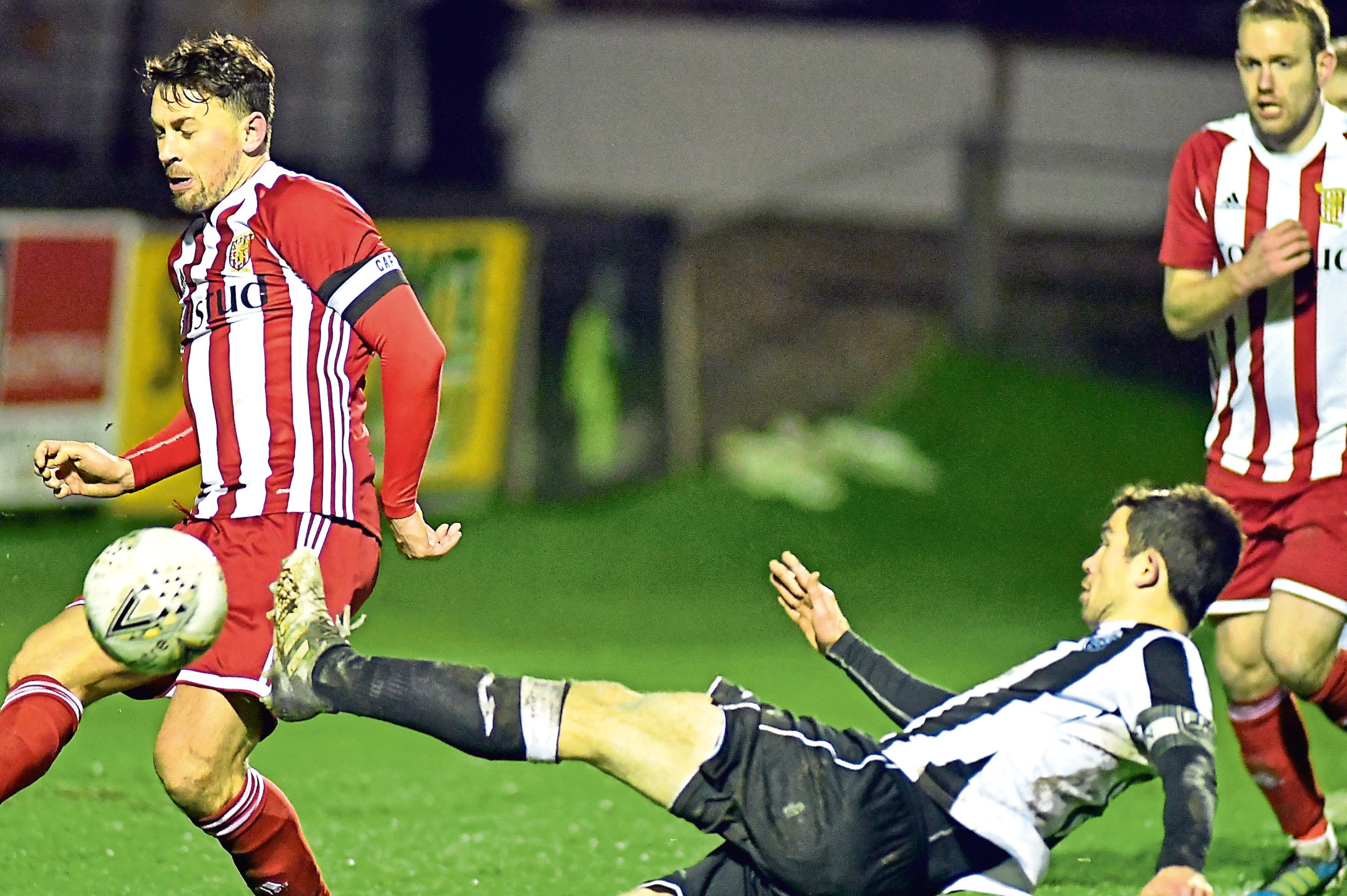 Fraserburgh's Willie West and Formartine's Stuart Anderson.
Picture by Chris Sumner