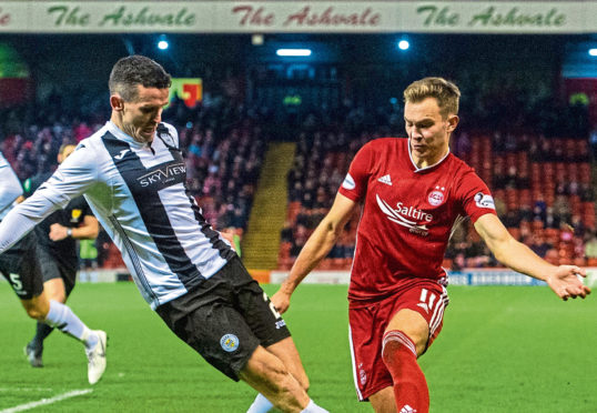 Aberdeen's Ryan Hedges (R) in action with St Mirren's Paul McGinn