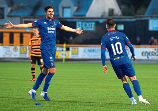 Inverness' Charlie Trafford, left, celebrates with goalscorer Aaron Doran