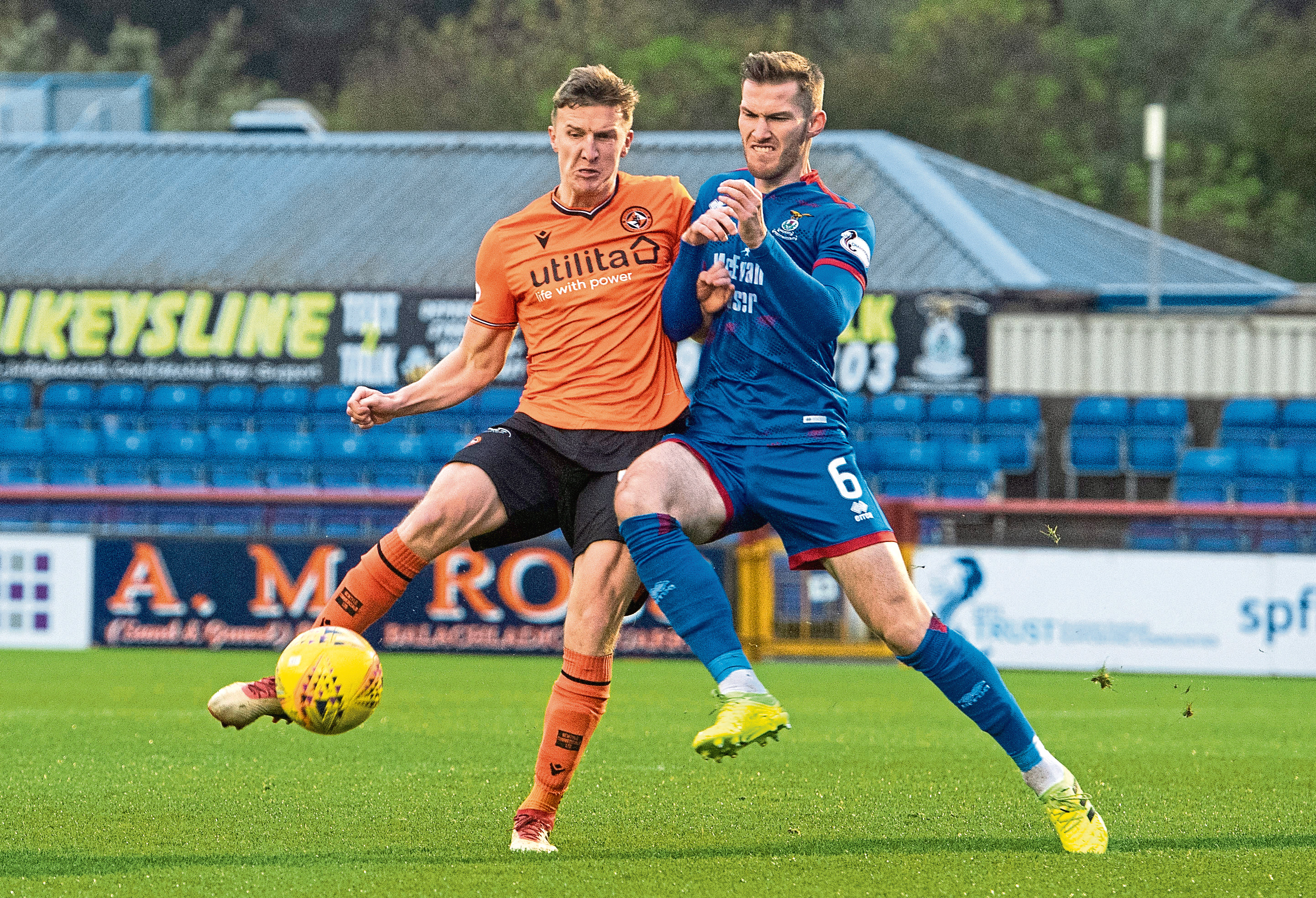 Dundee Utd's Paul Watson (L) and Inverness' Jamie McCart in action during the Ladbrokes Championship match between Inverness CT and Dundee United at the Caledonian Stadium, on November 2.