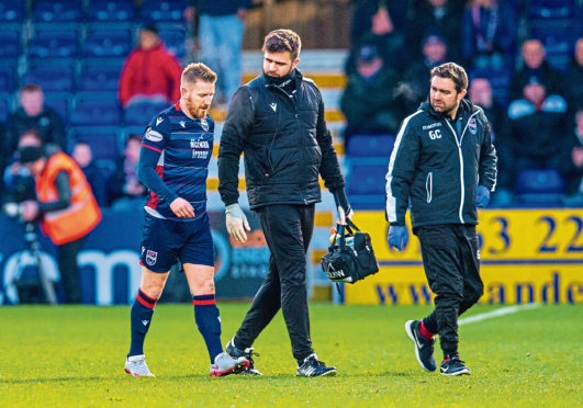 Michael Gardyne goes off injured during the Ladbrokes Premiership match between Ross County and Kilmarnock.