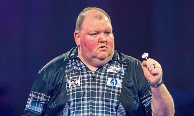 John Henderson wins his second round match against James Richardson during the PDC William Hill World Darts Championship at Alexandra Palace, London