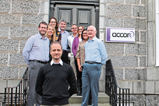 Accord Energy Solutions managing director James Arthur, front, with some of the firm's staff.