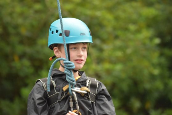 Archie Rough, 10, has earned all of his Cub Scout badges