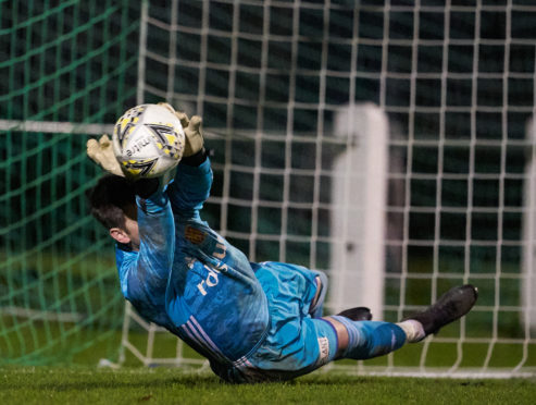 Kevin Main saves a Buckie spot-kick.