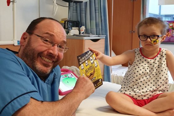 Six-year-old patient Etta nominates senior staff nurse Guy Wilson to grow a beard for Beard for Bairns.