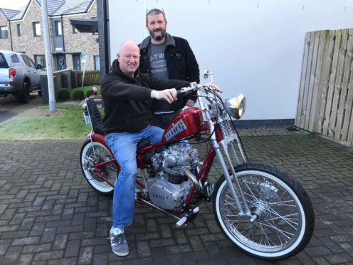 Winner James Cruickshank, on the bike, with Area Manager, Gordon Cruden,