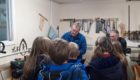 Chairman Steve Bramwell (Left) and member Michael Hutcheson giving primary six pupils from Avoch Primary School the grand tour of the Black Isle Men's Shed.