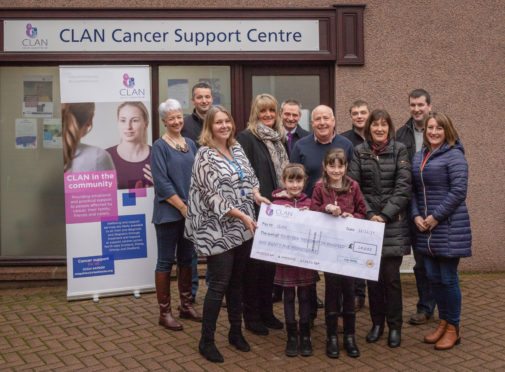 Staff from Leys Group and family members of Irene Steel donate to Clan