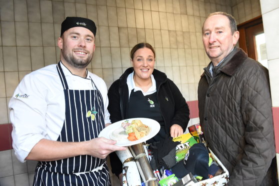 Chef Orry Shand and Lyla Munro from Entier with Mike Burns, chief executive of Aberdeen Cyrenians. Picture by Paul Glendell.