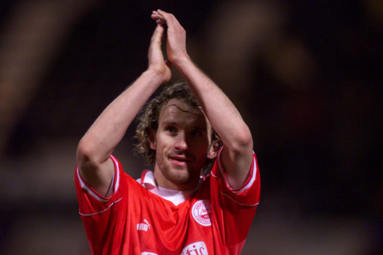 Arild Stavrum, in action for Aberdeen, salutes the Dons fans