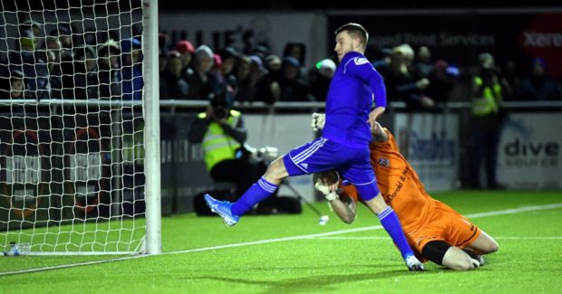 Cove's Mitchel Megginson beats Elgin keeper Thomas McHale to get the second..
Picture by Chris Sumner