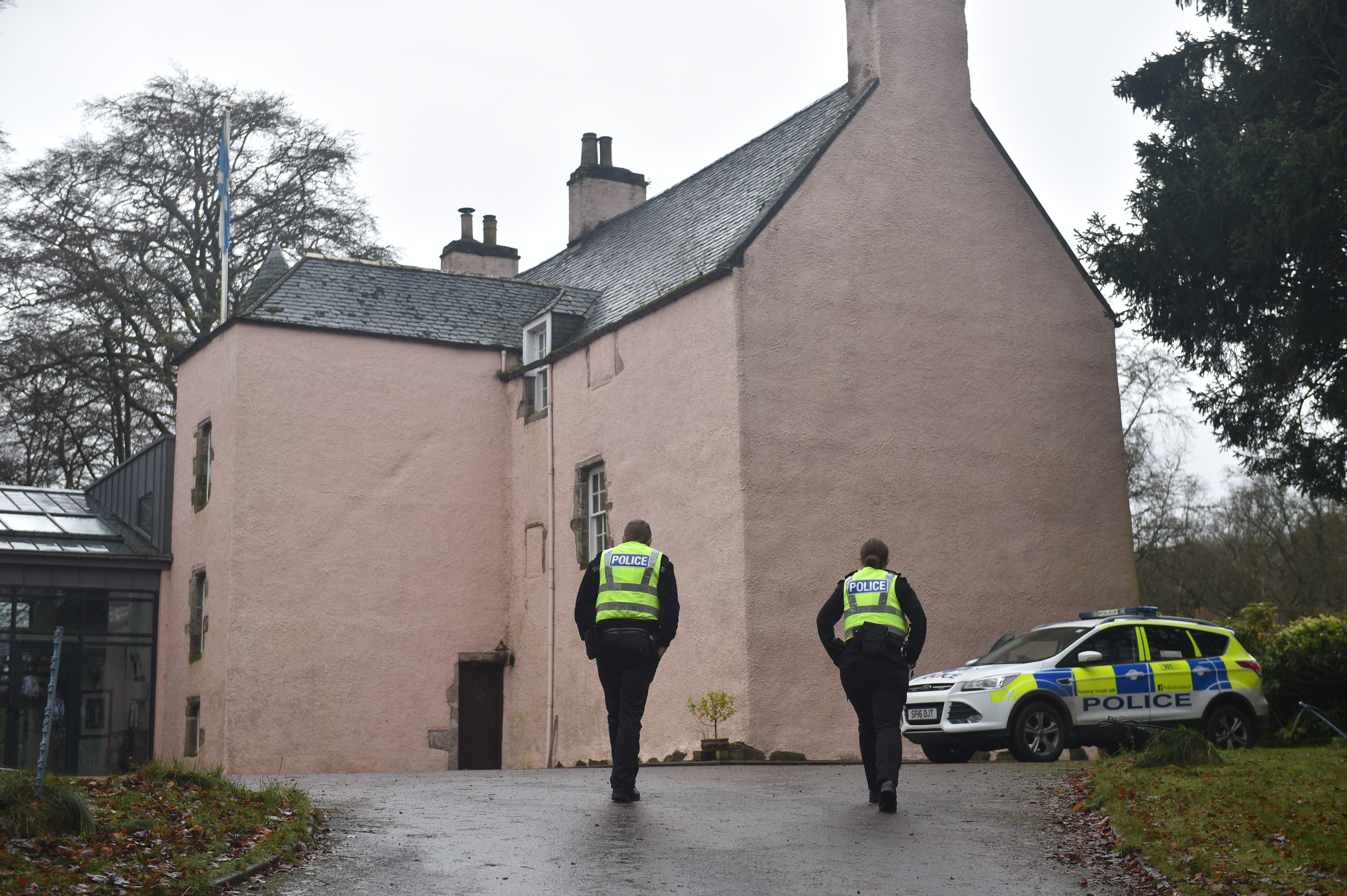 Police at the scene, where two bodies were found at a Mergie holiday cottages.