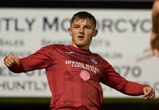 Brora's James Wallace celebrates scoring.