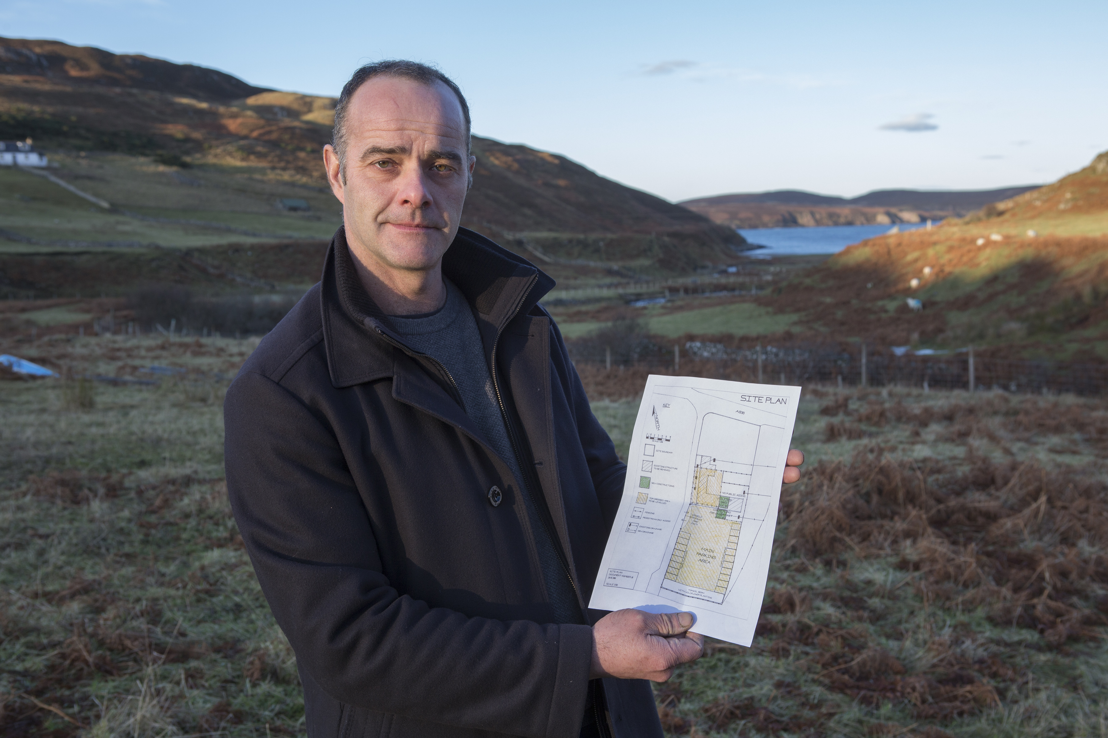 Kris Scott with his site plans for a cleaning pod at Durness, near Smoo Cave.