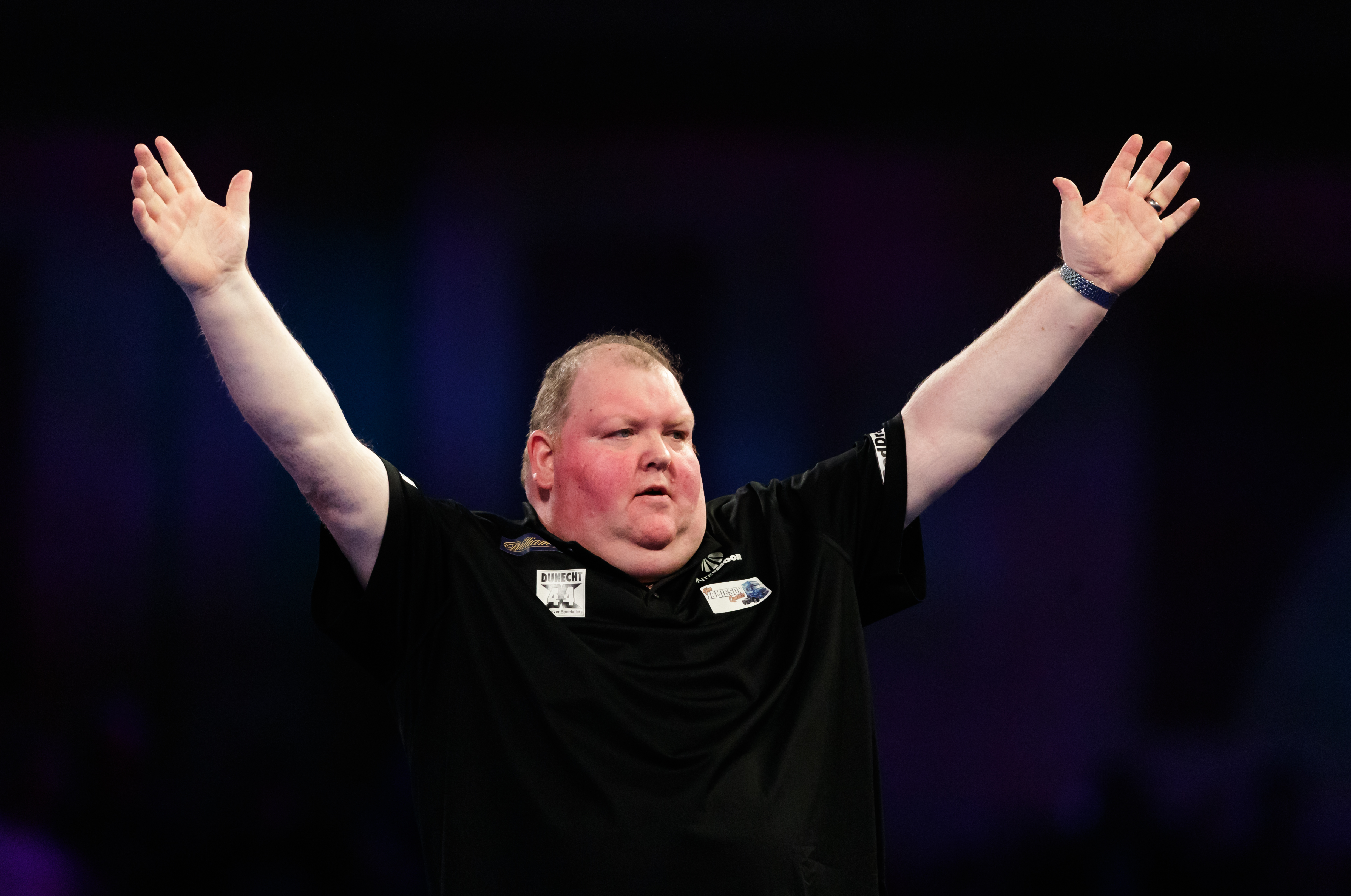 John Henderson celebrates defeating Gabriel Clemens during day nine of the William Hill World Darts Championships at Alexandra Palace, London.