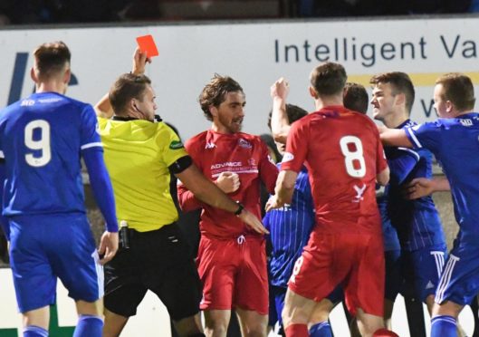 REFEREE CHRIS GRAHAM SHOWS RED TO SIMON FERRY