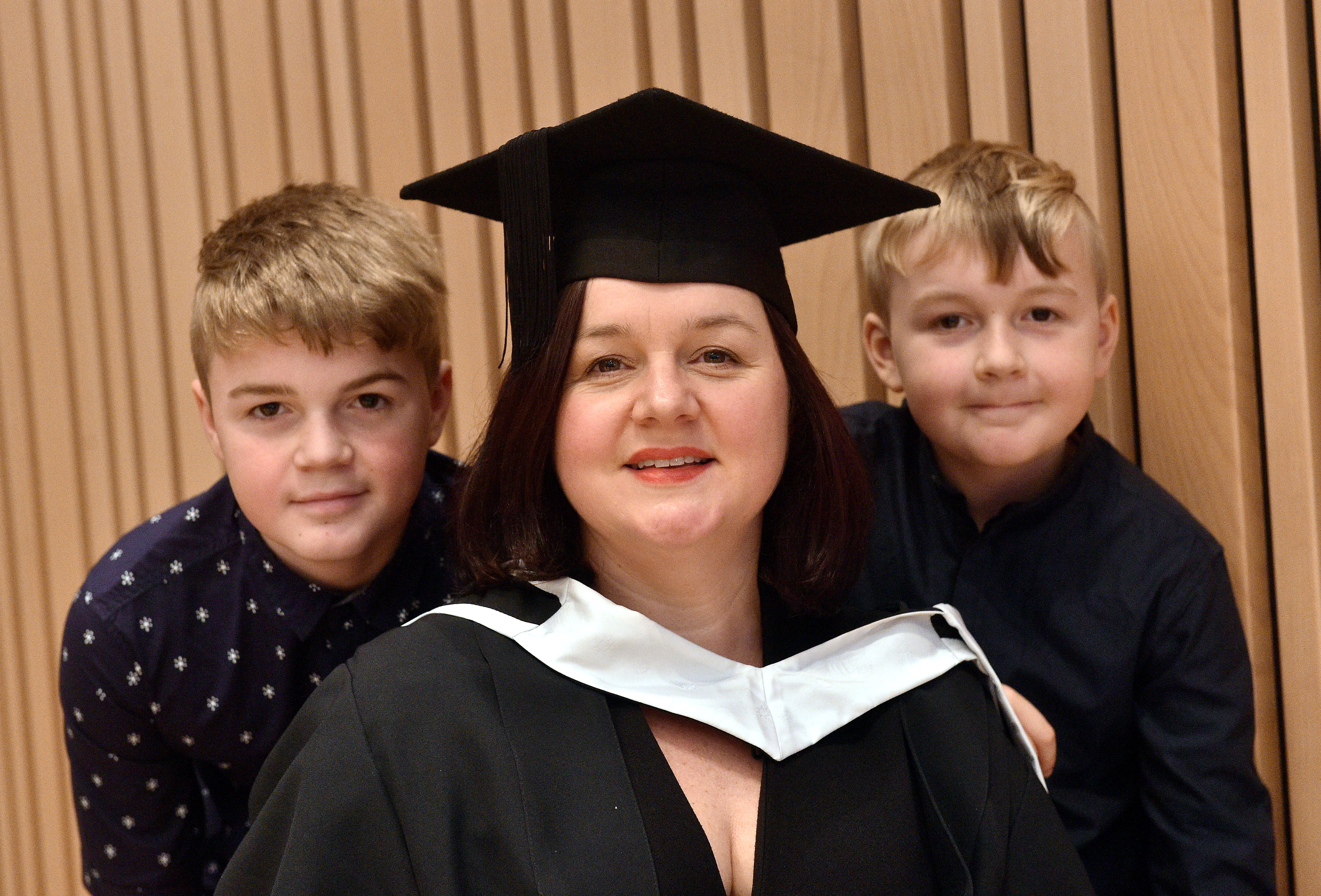 RGU Winter Graduations at Music Hall, Aberdeen
Pictured is Charlotte McLean with her sons from left Callum, 14 and Ioan, 10 (Corr). MSc Data Science An Aberdeen-based mature student has reignited her passion for data after heading back into education to complete a Masters Degree in Data Science at RGU. Charlotte McLean (45), who is originally from Cardiff, lost her job during the oil crash and found herself commuting to Edinburgh for a role which lasted over three years. She then made the choice to go back to university to give her the opportunity to enhance her skills with a view to gaining a role in the city she and her family had settled in. North-East 
Picture by DARRELL BENNS 
Pictured on 11/12/2019   
CR0014966