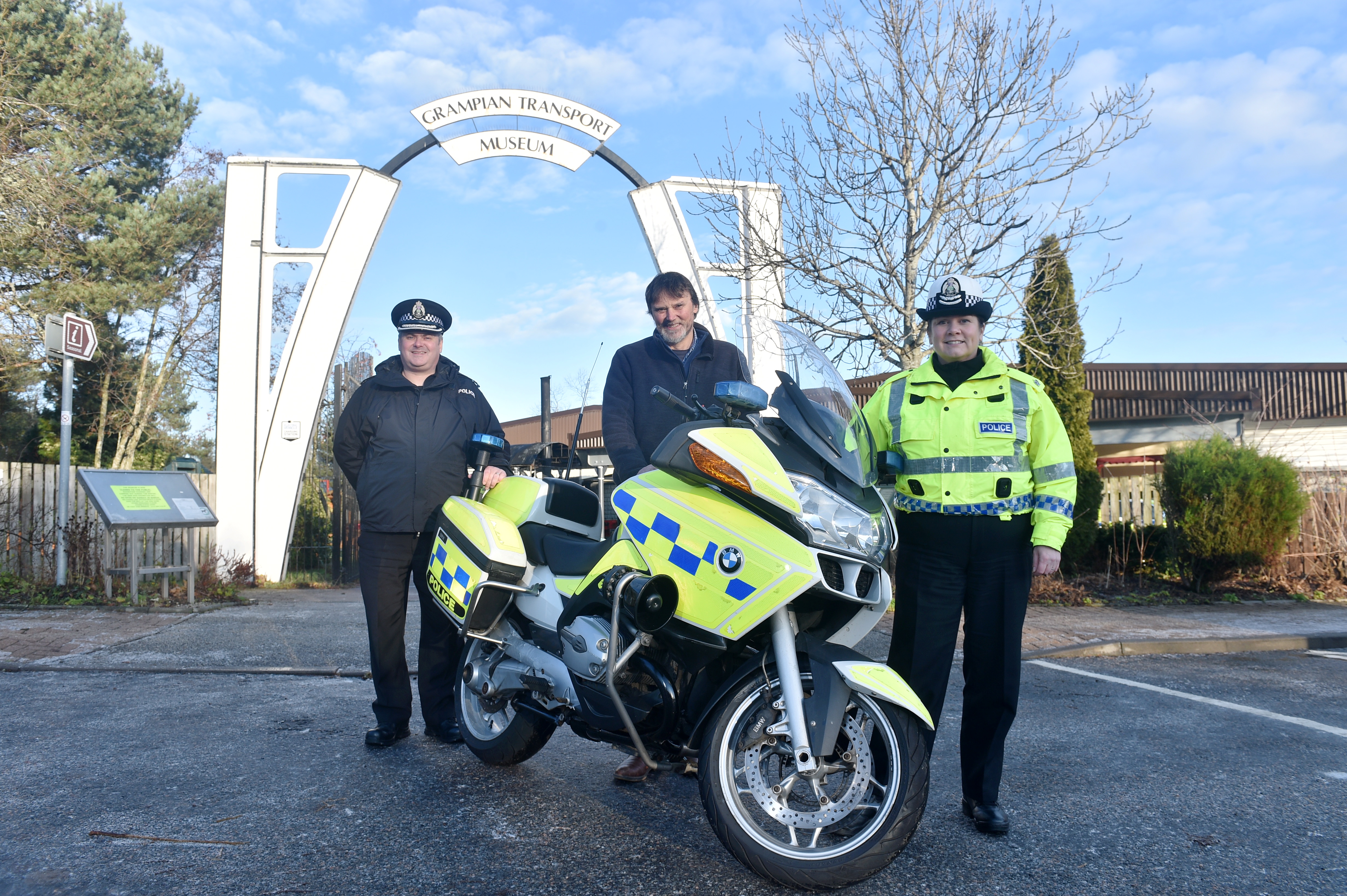 Pictured are from left, Superintendent Stewart Mackie from Police Scotland,  Mike Ward MBE, Curator, Grampian Transport Museum and Superintendent Louise Blakelock. 
A Police motorcycle was donated to Grampian Transport Museum, Alford. The 'retired' motorcycle, a 2009 BMW R1200RT, has reached the end of its service with the Road Policing Unit and will join an ex-Grampian Police 1985 Rover SD1 Vitesse that is already on display at the museum. 
Picture by DARRELL BENNS 
Pictured on 16/12/2019   
CR0017601 / CR0017539