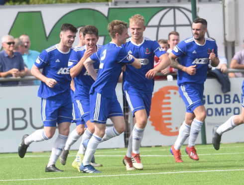 Cove players celebrate Harry Milne's goal against Edinburgh City.