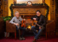 Founder James Alexander (fiddle) and committee member Colin Mackay (guitar), Picture by Jason Hedges