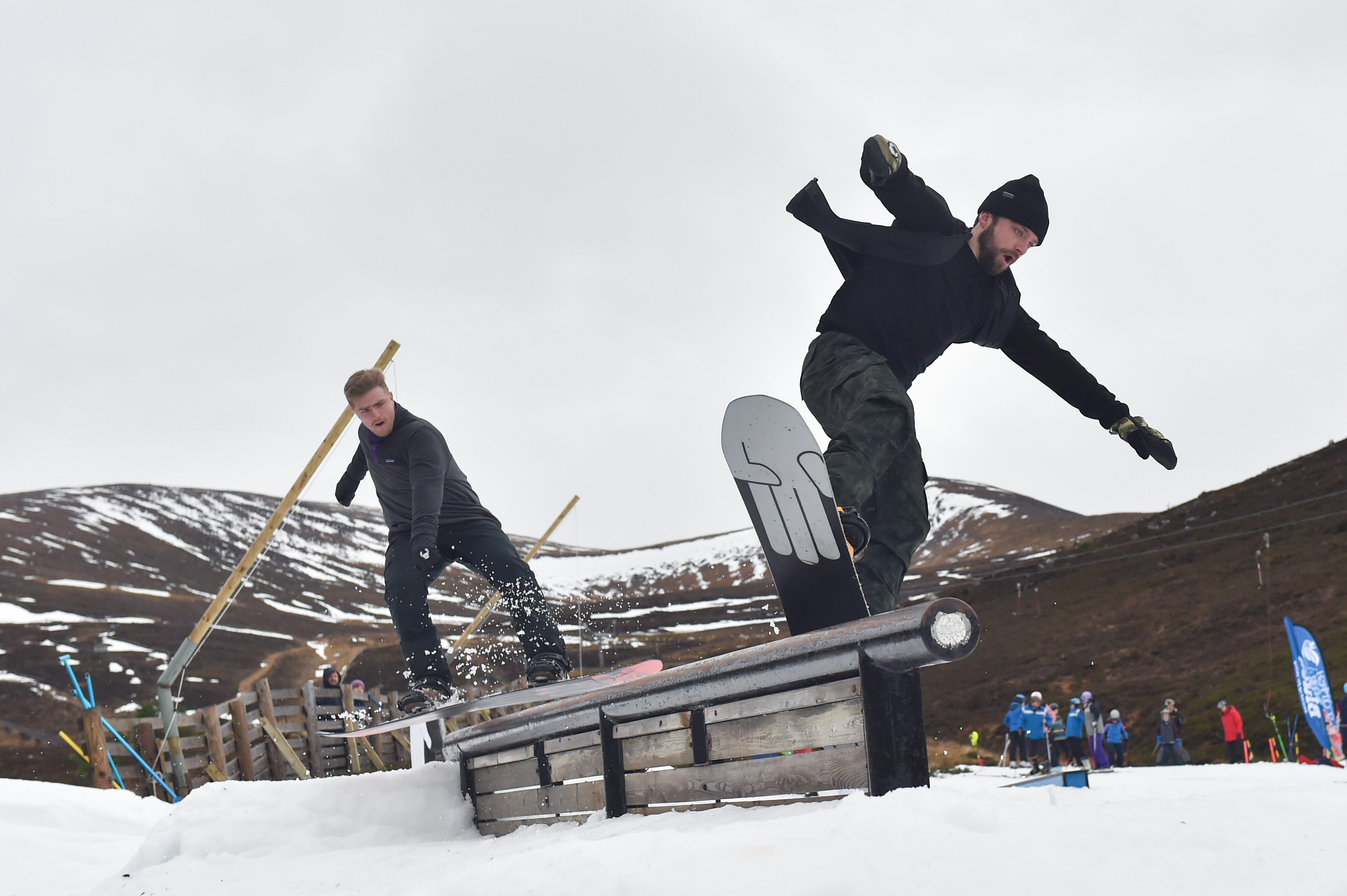 Local snow boarders and brothers Jamie  and Angus Trinder from Aviemore use the rail to get air. Picture by Jason Hedges