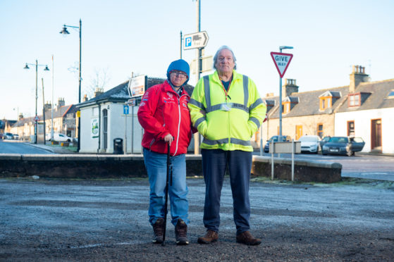 Keith residents Stuart and Shona Robertson are concerned the car park outside their house is being used as a rat run to get access to the A96. Picture by Jason Hedges.