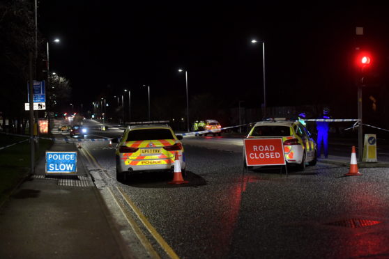 Police on site of the crash on Lang Stracht, Aberdeen.