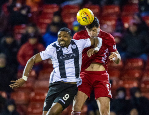 St Mirren's Jonathan Obika, left, in action with Aberdeen's Scott McKenna.