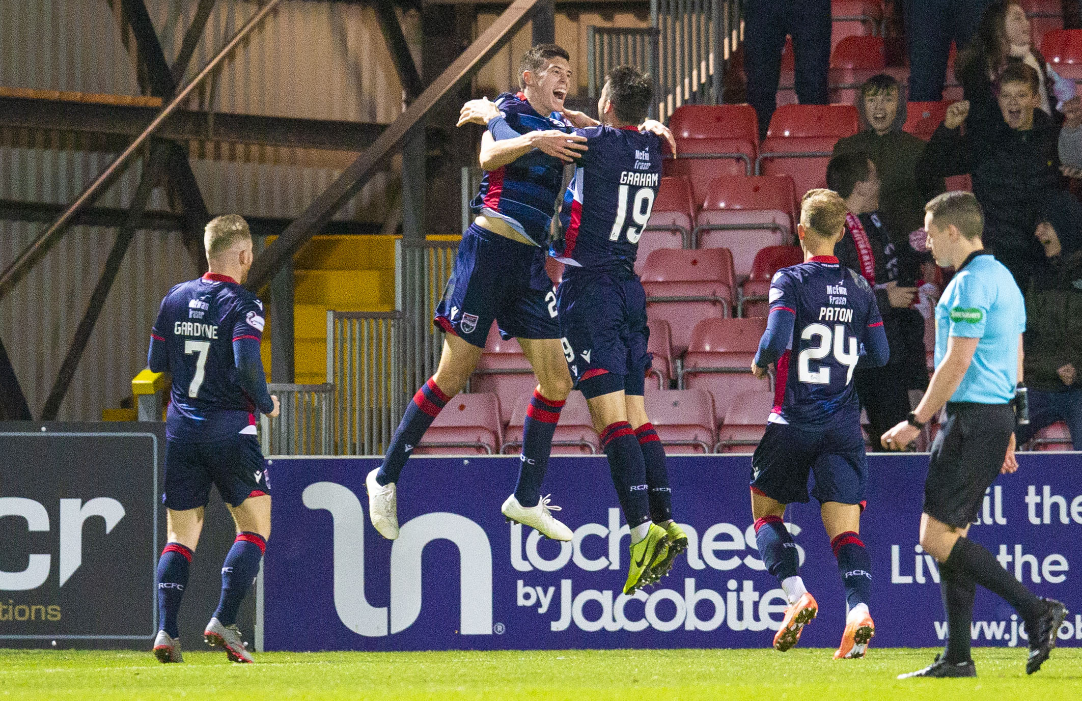 Ross Stewart celebrates scoring with his Ross County teammates.