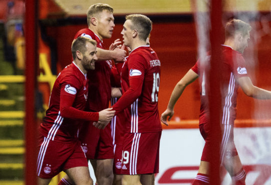 Niall McGinn, Sam Cosgrove and Lewis Ferguson celebrate the opening goal during the Ladbrokes Premiership match between Aberdeen and Hamilton Academical.