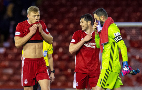 Sam Cosgrove, Scott McKenna and Joe Lewis at full time during the Ladbrokes Premiership match between Aberdeen and Hamilton.