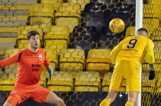 Livingston's Lyndon Dykes secures his hat-trick with a diving header during a Ladbrokes Premiership match between Livingston and Ross County.