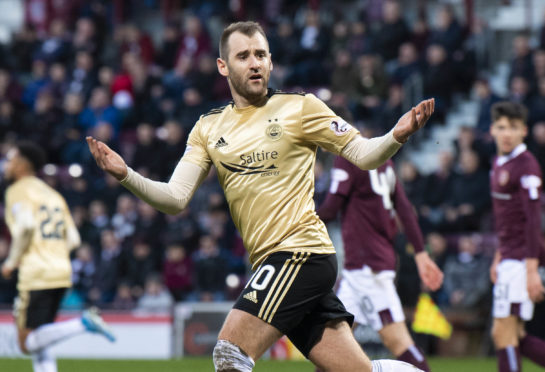 Niall McGinn celebrating a goal for Aberdeen at Hearts in