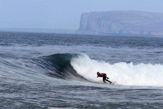Surfing five miles from Caithness. Pic: VisitScotland.