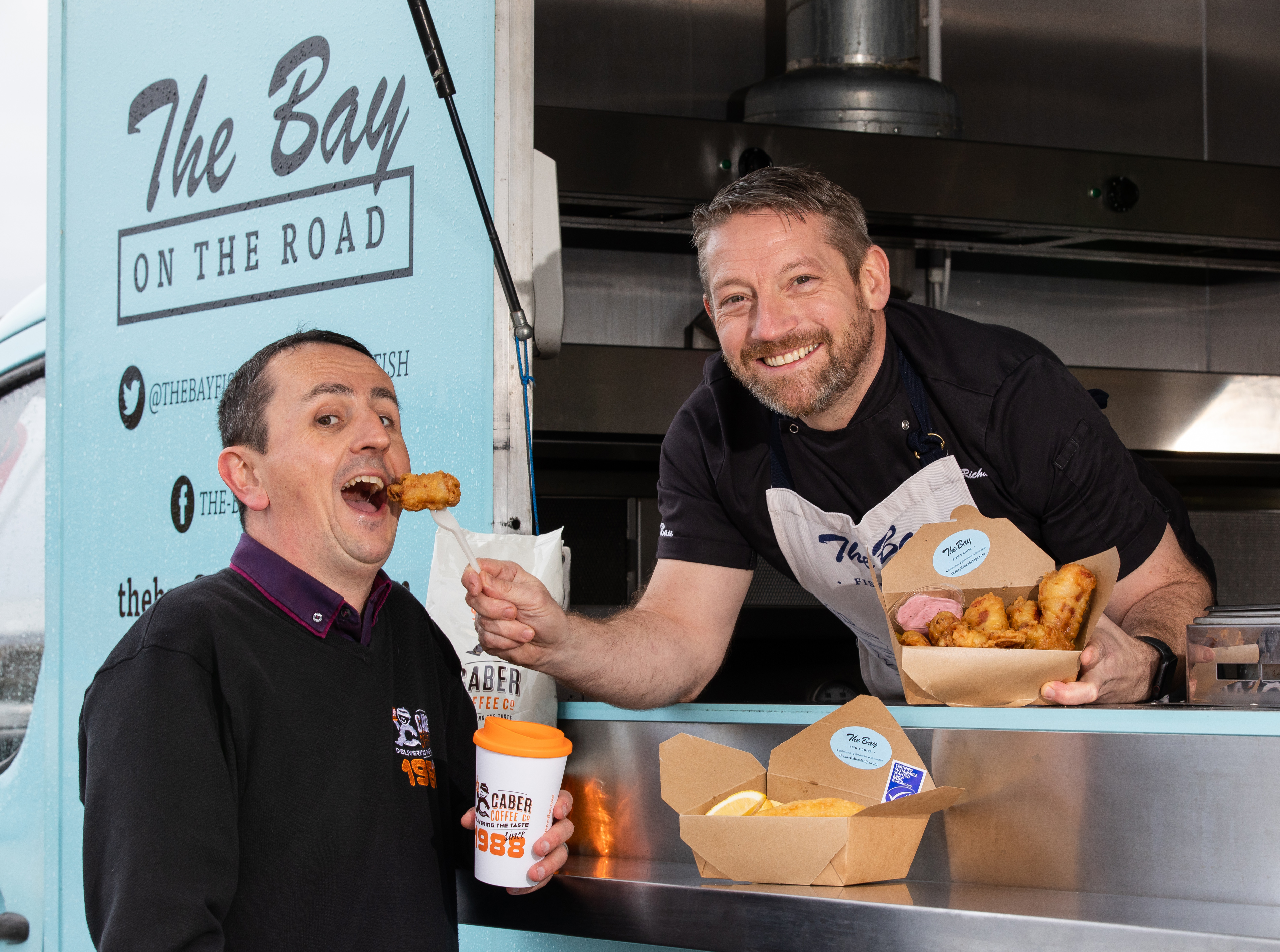 Calum Richardson from The Bay Fish and Chips and Findlay Leask from Caber Coffee who will be raising funds for CFINE by selling pigs in blankets, fish and chips, and coffee in Aberdeen city centre.